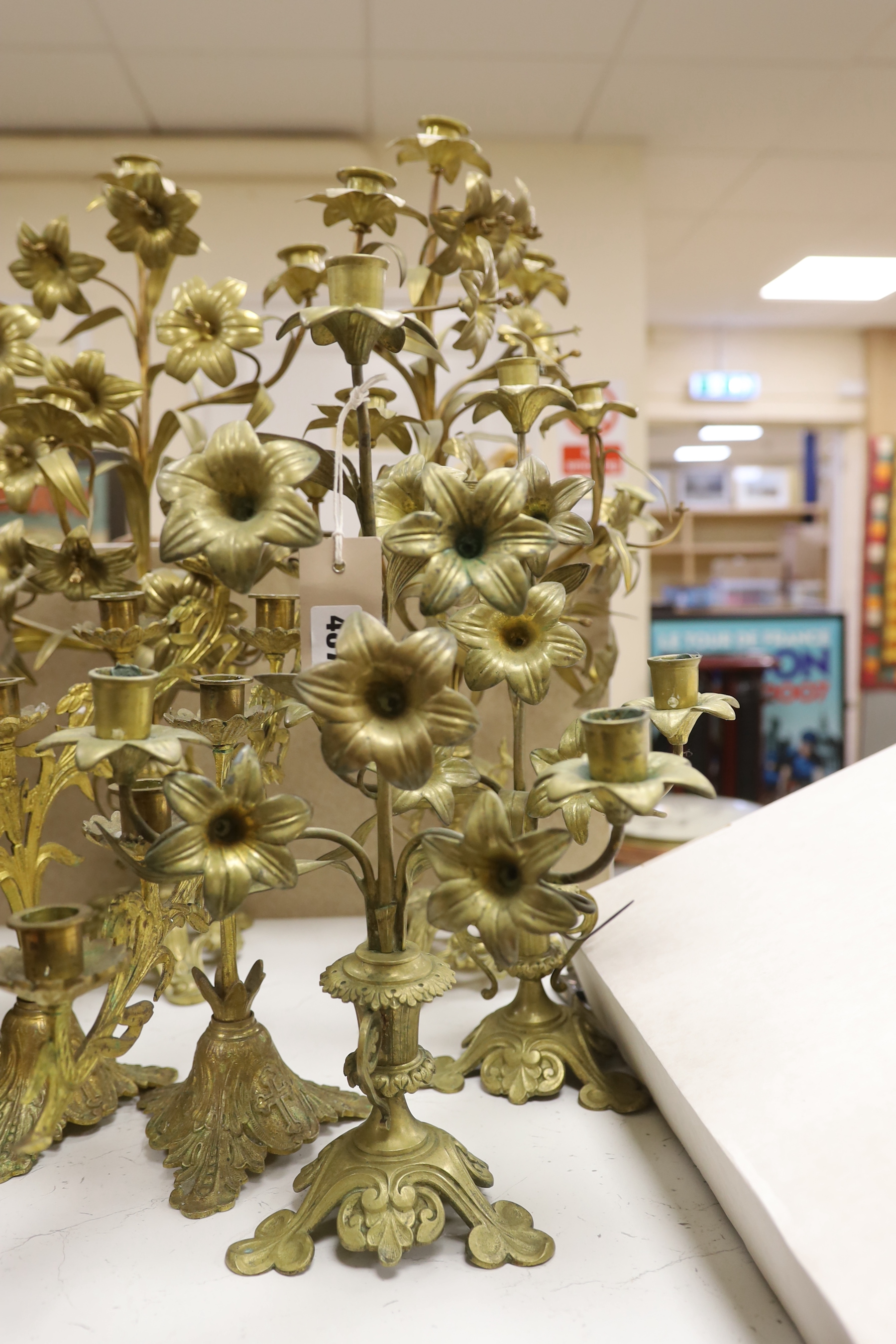 Three pairs of brass plant form candlestands / candelabra